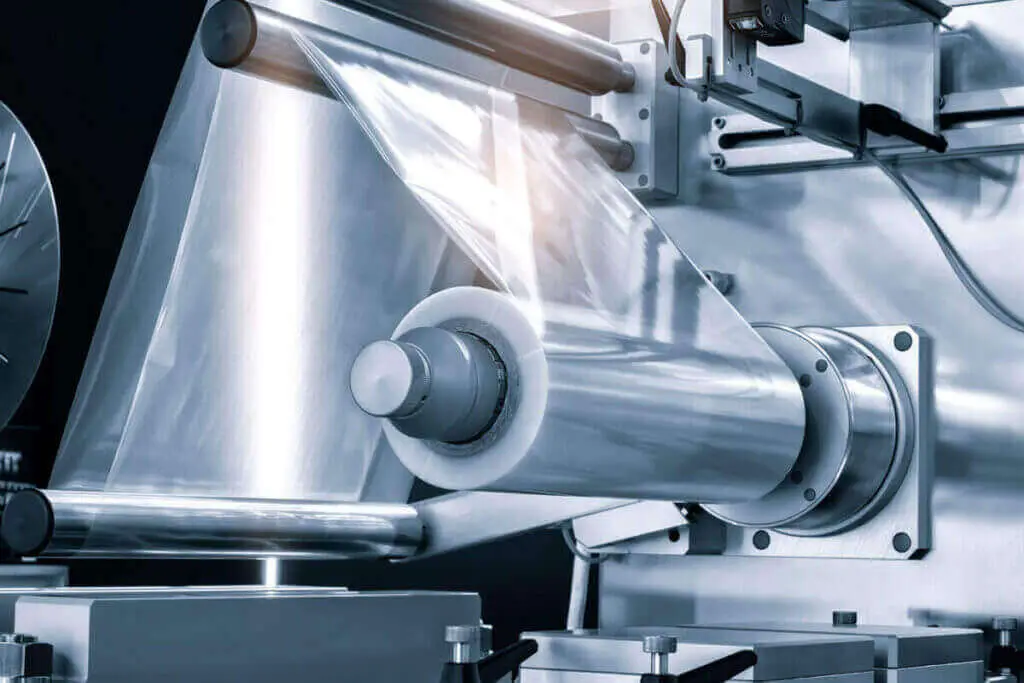 a plasma machine treating the film's surface