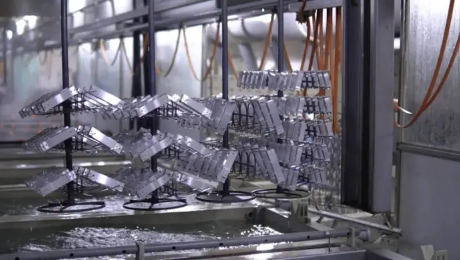 placing metal parts in the electrolyte